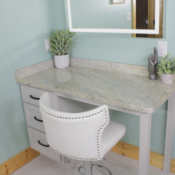 A double vanity with a separate makeup vanity
