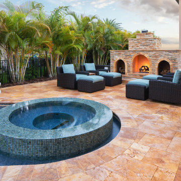 Custom Pool with Spa, Sun Shelf, and Pebble Tec Finish in Parkland Fla.