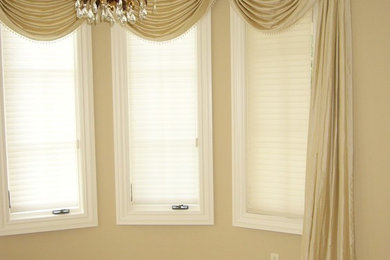 Inspiration for a mid-sized timeless enclosed dining room remodel in New York with beige walls