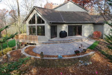 Photo of a large modern backyard partial sun garden in Minneapolis with a garden path and brick pavers.