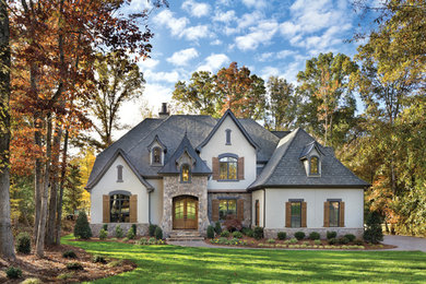 Example of a large transitional two-story exterior home design in Cincinnati with a hip roof
