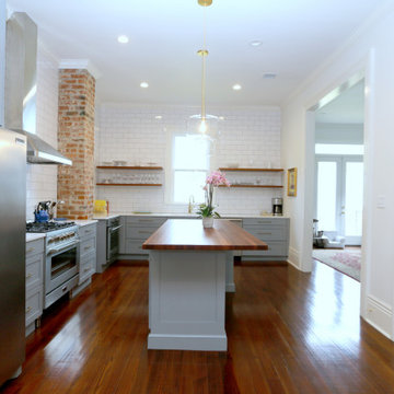 Open shelving and exposed brick are among the many details that encompass the si