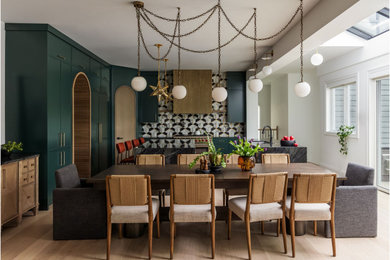 Great room - eclectic light wood floor and beige floor great room idea in Chicago with white walls