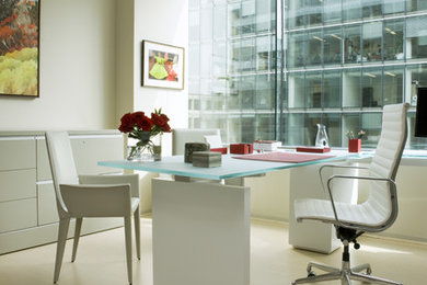 Mid-sized trendy freestanding desk laminate floor and beige floor home office photo in DC Metro with beige walls
