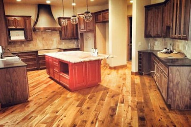 Kitchen - modern medium tone wood floor kitchen idea in Other