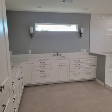 Two separate bathrooms converted into a master bathroom with a big open closet