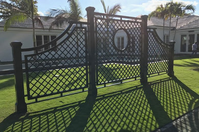 Photo of a large tropical courtyard full sun outdoor sport court for spring in Miami with a garden path and gravel.
