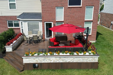 Deck - large traditional backyard deck idea in Other with no cover