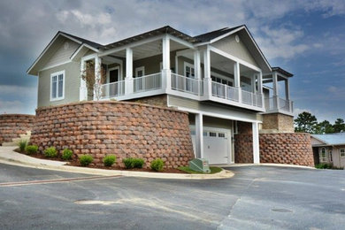 Mid-sized craftsman beige two-story vinyl exterior home idea in Little Rock with a shingle roof