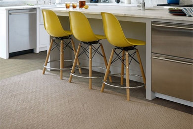 Inspiration for a mid-sized 1960s l-shaped light wood floor enclosed kitchen remodel in Other with an undermount sink, glass-front cabinets, white cabinets, marble countertops, gray backsplash, stone slab backsplash, stainless steel appliances and an island