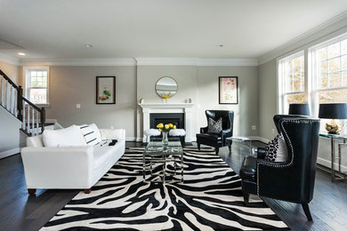 Inspiration for a transitional formal and open concept dark wood floor living room remodel in DC Metro with gray walls and a standard fireplace