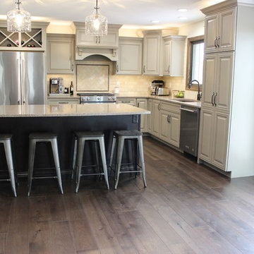Farmhouse kitchen Taupe Painted Cabinets,Quartz Tops, and Dark Island