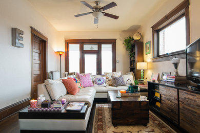 Example of an eclectic enclosed dark wood floor family room design in Salt Lake City with white walls, no fireplace and a tv stand