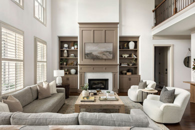 Living room - transitional open concept dark wood floor, brown floor and wainscoting living room idea in Nashville with white walls, a wood stove and a concrete fireplace