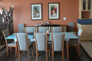 Example of a mid-sized beach style great room design in Los Angeles with orange walls and no fireplace
