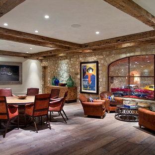 Photo of a large farmhouse fully buried basement in Orange County with white walls, no fireplace, dark hardwood flooring and brown floors.