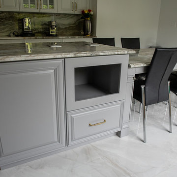 Transitional Kitchen Done in a 2 Tone Color With Integrated Dining Table