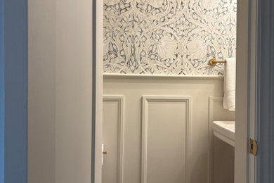 Powder room - dark wood floor powder room idea in Ottawa with a one-piece toilet and a pedestal sink