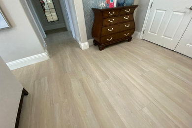 Inspiration for a large transitional porcelain tile and beige floor entryway remodel in Orlando