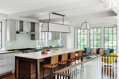 Example of a mid-sized transitional galley dark wood floor open concept kitchen design in Boston with an island, an undermount sink, shaker cabinets, gray cabinets, glass tile backsplash and stainless steel appliances