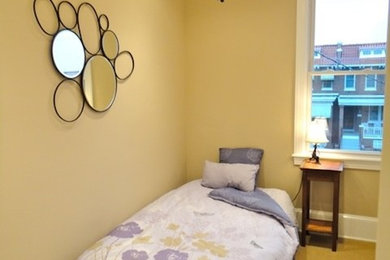 Carpeted bedroom photo in DC Metro with yellow walls