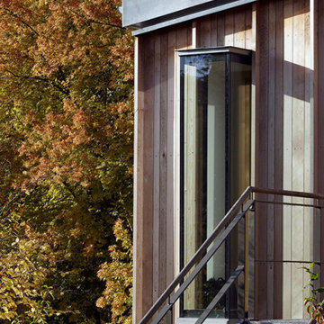 Timber facade, glass pop out window, zinc roof