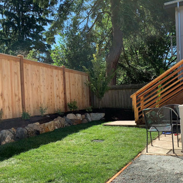 Deck platform, fence, hardscape, garden and planters.
