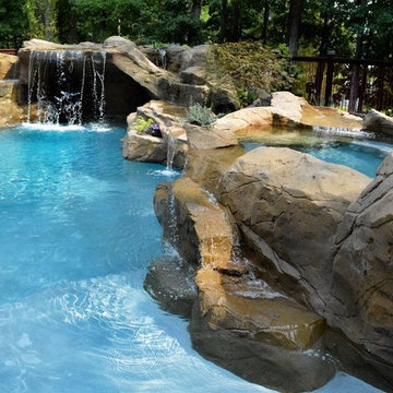 Gunite Pool with Grotto. Waterfalls into pool off multiple faux rocks.