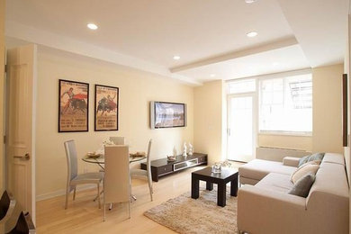 Example of a mid-sized trendy open concept bamboo floor living room design in New York