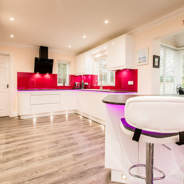 Modern Gloss White Kitchen with a Vibrant Twist