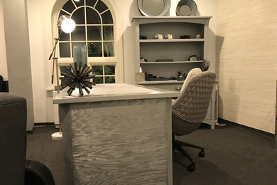 Example of a transitional home office design in New York