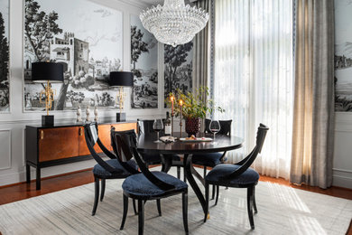 Example of a mid-sized transitional medium tone wood floor and wallpaper kitchen/dining room combo design in Houston with gray walls and no fireplace