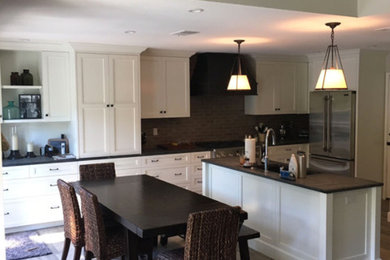 Inspiration for a mid-sized modern medium tone wood floor and brown floor kitchen/dining room combo remodel in San Diego with beige walls and no fireplace