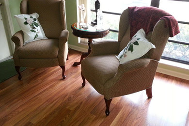 Mid-sized medium tone wood floor living room photo in Miami with beige walls, no fireplace and no tv