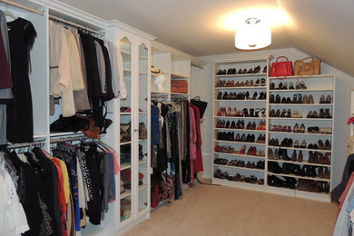 Inspiration for a large timeless gender-neutral walk-in closet remodel in Philadelphia with white cabinets and open cabinets