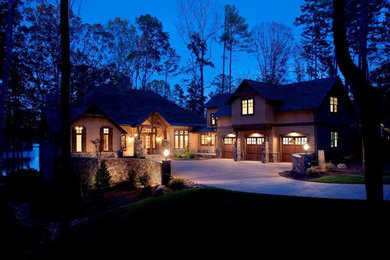Example of a mountain style two-story wood gable roof design in Austin