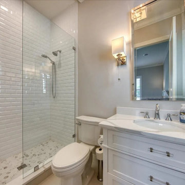 Custom White Subway Tile Bathroom With Modern Storage Vanity