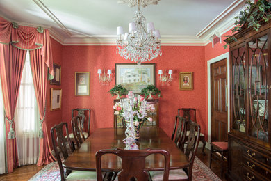 Dining room - mid-sized traditional dining room idea in Other with red walls