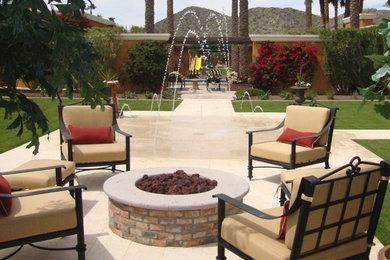 Mid-sized elegant backyard tile patio photo in Phoenix with a fire pit and a pergola