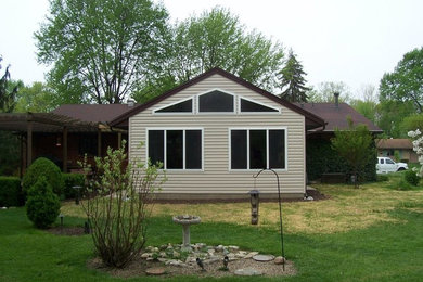 Example of an island style patio design in Other