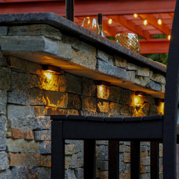 Make a Statement with a Versatile Outdoor Kitchen and Double Fire Feature