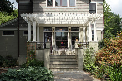 Inspiration for a mid-sized arts and crafts three-storey grey house exterior in DC Metro with vinyl siding.