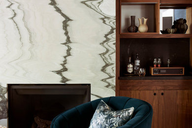 Inspiration for a contemporary family room remodel in San Francisco with a standard fireplace and a stone fireplace