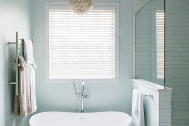 Inspiration for a mid-sized transitional master white floor bathroom remodel in Other with shaker cabinets, gray cabinets, blue walls, quartz countertops, a hinged shower door, white countertops and a built-in vanity