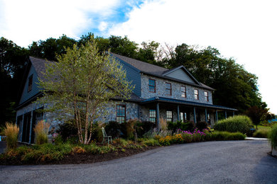 Country gray concrete fiberboard gable roof idea in Other