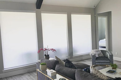 Trendy exposed beam family room photo in Dallas
