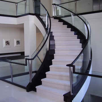 Curved Staircase With Glass Balustrade