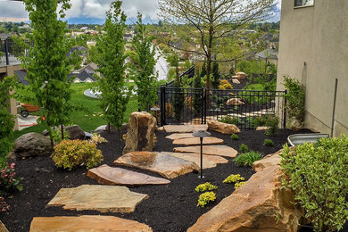 Inspiration for a large transitional side yard xeriscape in Salt Lake City with mulch.