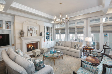 Inspiration for a huge transitional enclosed dark wood floor, brown floor and coffered ceiling family room remodel in Houston with a standard fireplace, a stone fireplace, beige walls and a media wall