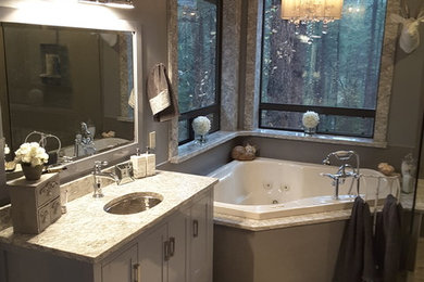 Mid-sized trendy master gray tile and porcelain tile porcelain tile bathroom photo in Phoenix with flat-panel cabinets, gray cabinets, a two-piece toilet, gray walls, an undermount sink and quartz countertops